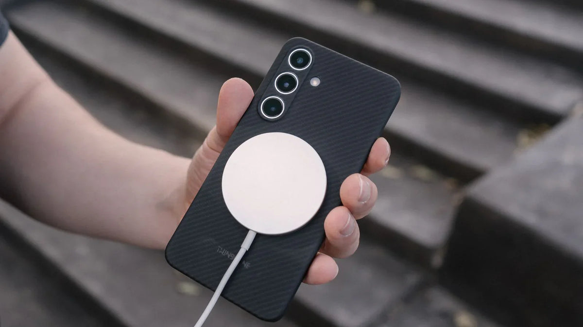man holding Galaxy S24 with magsafe charger and aramid fiber matte black magnetic case