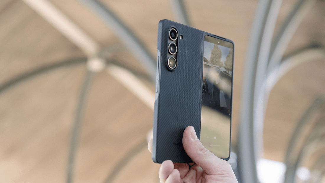 a hand holding a phone with samsung galaxy z fold 5 carbon fiber case