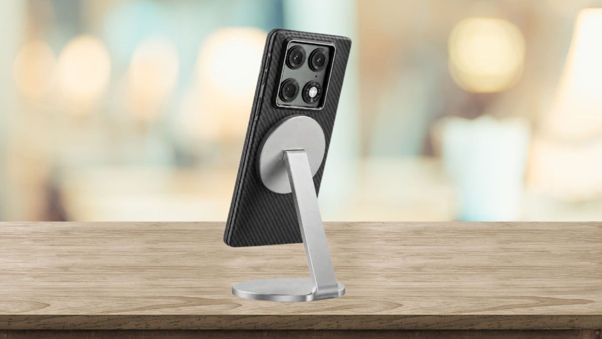 Motorola Razr Fold with ThinBorne aramid fiber MagSafe case attached to a magnetic aluminum desk stand