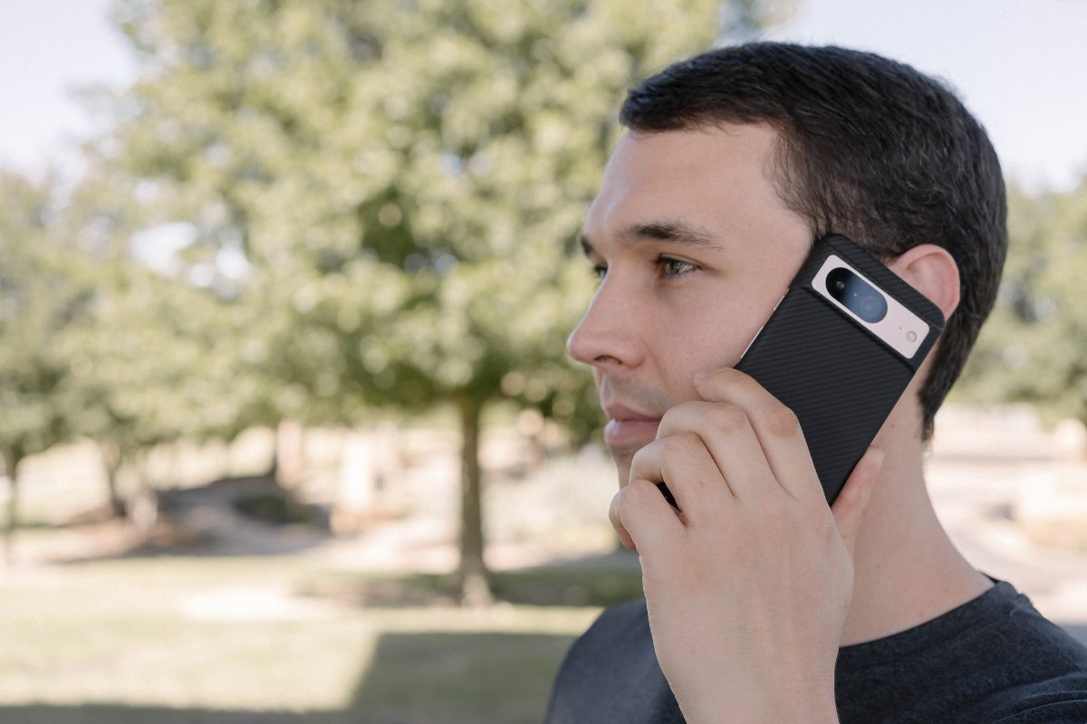 A man having a call using Pixel 8 with thin fiber case from Thinborne