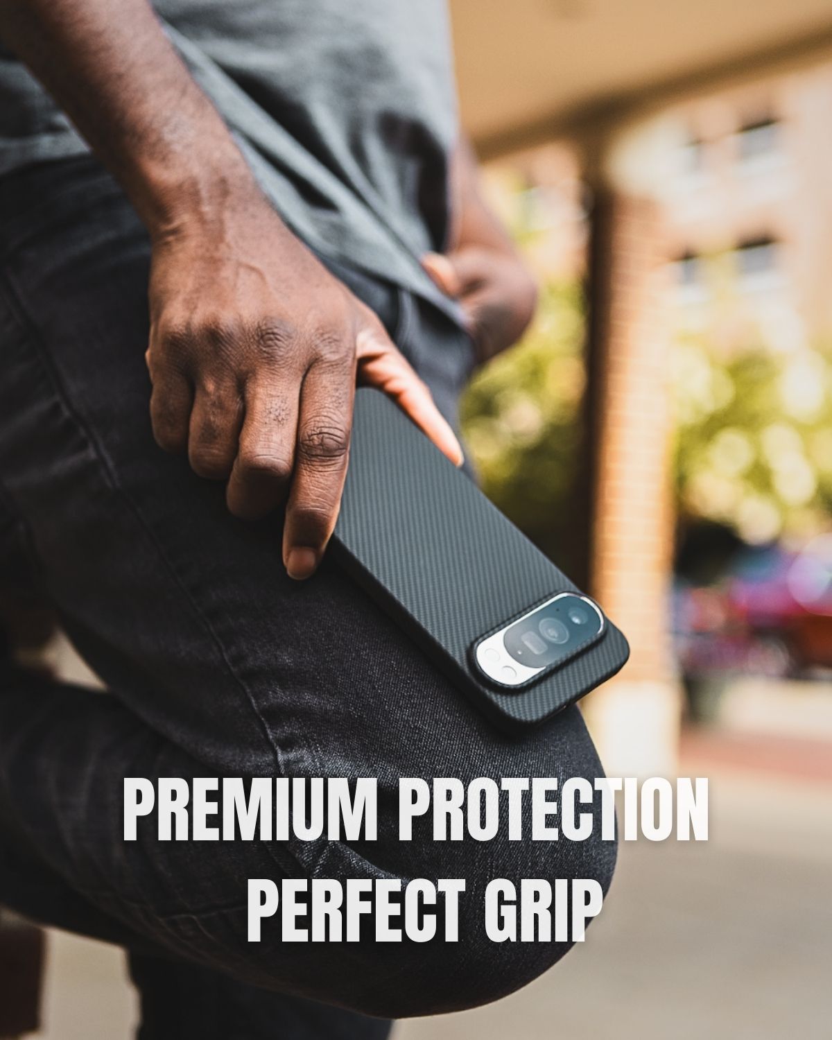 A man holding a Google Pixel 10 pro  with a black carbon fiber case on his leg, showcasing the text 