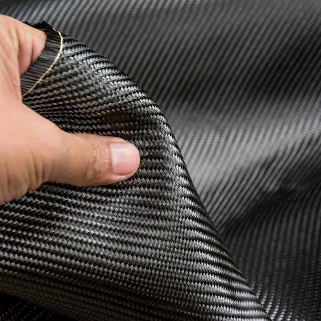 a hand holding 600d aramid fiber fabrics
