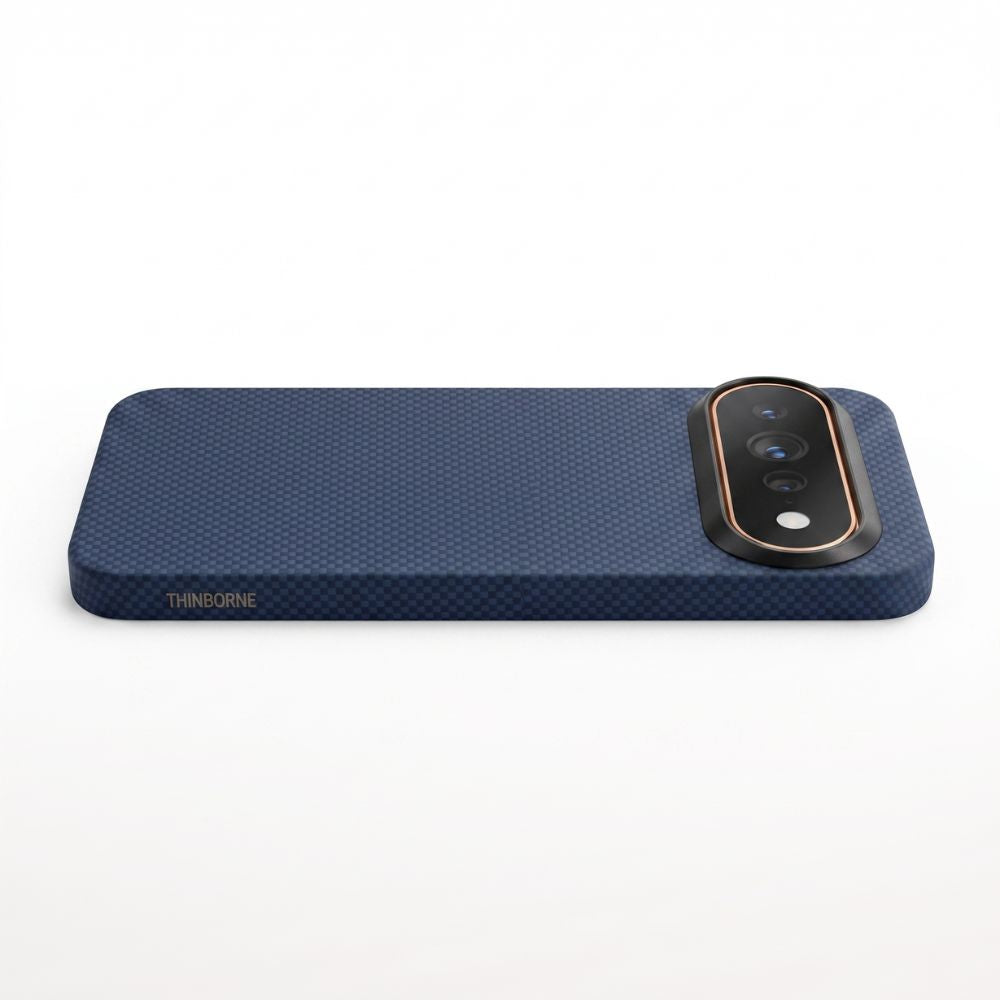 A dark navy blue google pixel 11 pro xl  phone case with a carbon-fiber pattern, featuring a black camera bezel with a rose gold accent ring and the brand name 'THINBORNE' in gold on the bottom left, shown on a white background.