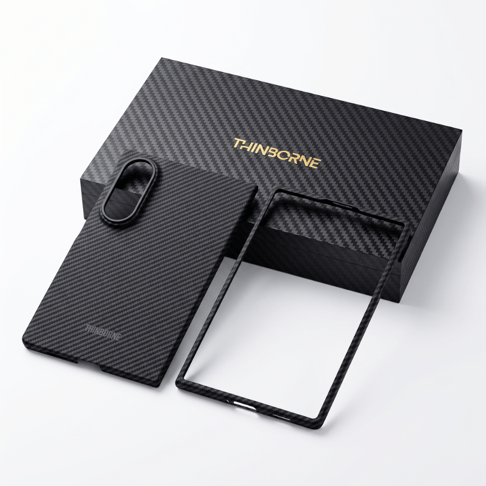 A black carbon fiber galaxy z fold 8  phone case and a matching black frame accessory displayed in front of a black carbon fiber THINbORNE box on a clean white background.