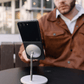 galaxy z flip 8 case attached securely to a silver magnetic desk stand in a lifestyle setting.