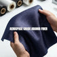 Aerospace-grade aramid fiber with a hand holding it, text about its properties.
