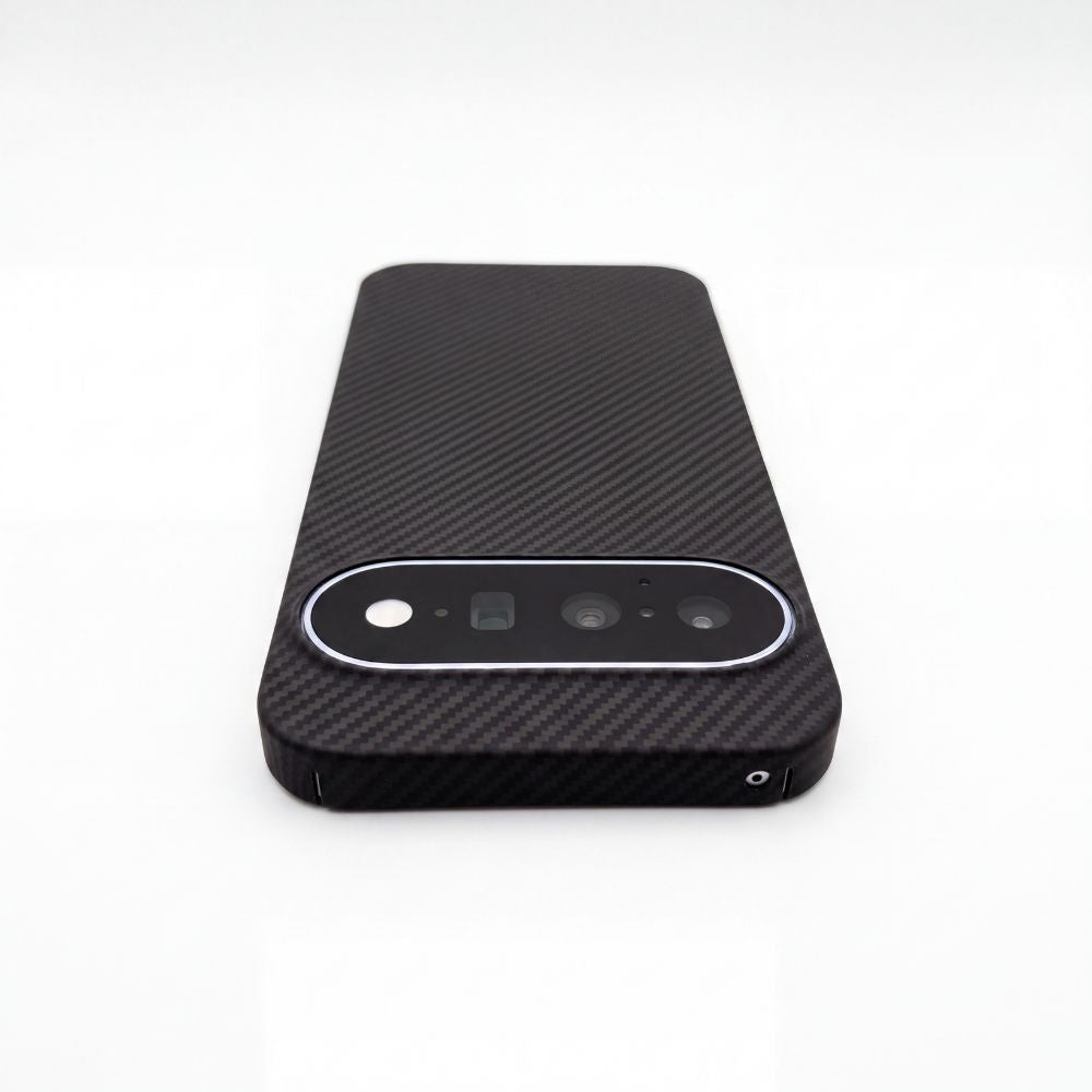 A black carbon fiber textured pixel 11  case with a circular camera cutout, shown from the back on a white background.