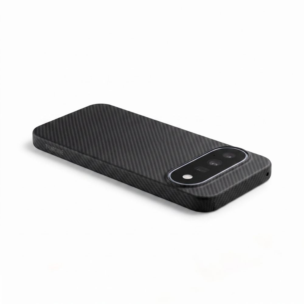 A black carbon fiber google pixel 11 phone case with a raised camera bumper, shown from an angled perspective on a clean white background.