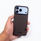 iphone 18 pro max with brown aramid fiber case held by a hand