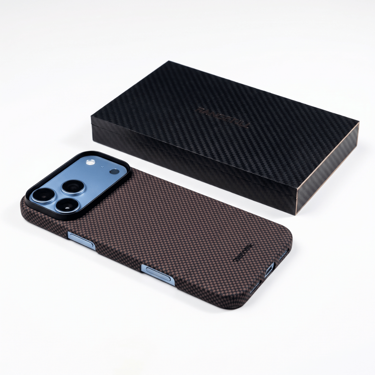 iphone 18 pro max with aramid fiber case laying on the surface next to the package