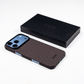 iphone 18 pro max with aramid fiber case laying on the surface next to the package