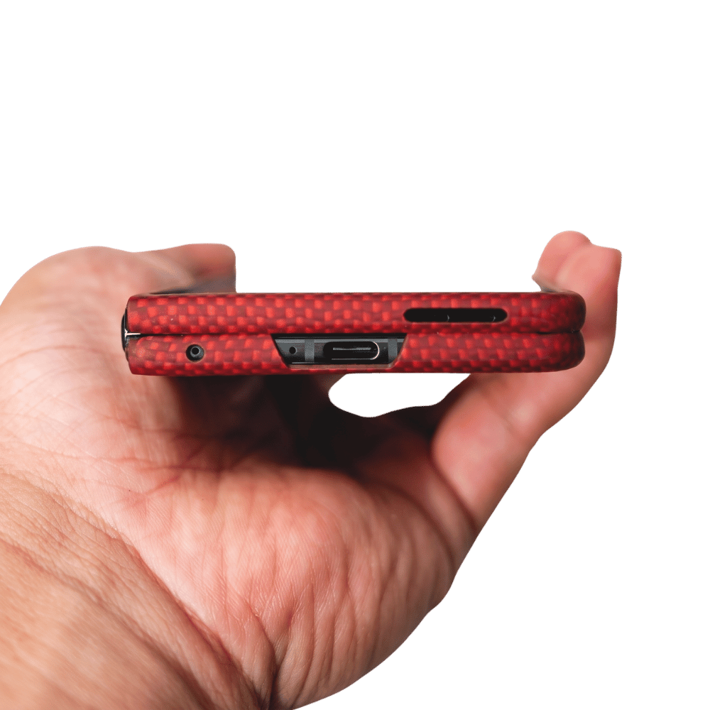 motorola razr fold with red aramid fiber held by a male hand to show the design of the bottom sides