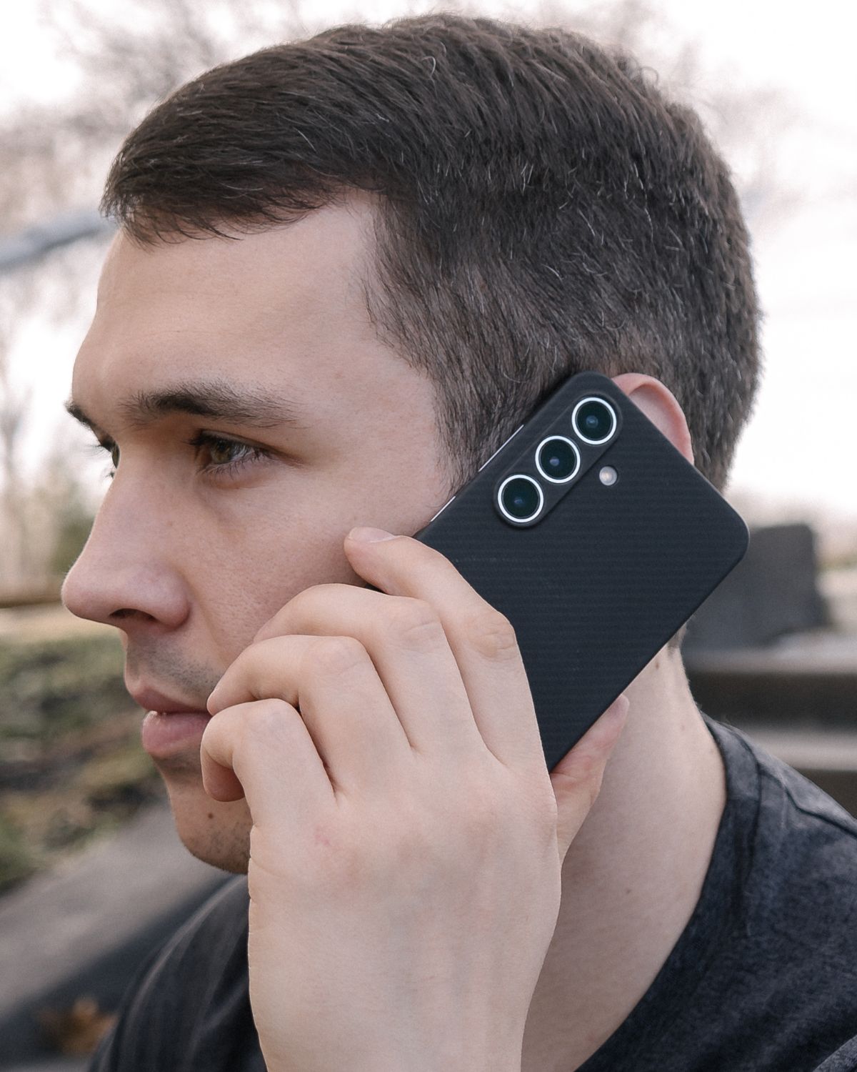 Galaxy S25 Plus case held during a phone call, showing clean design.
