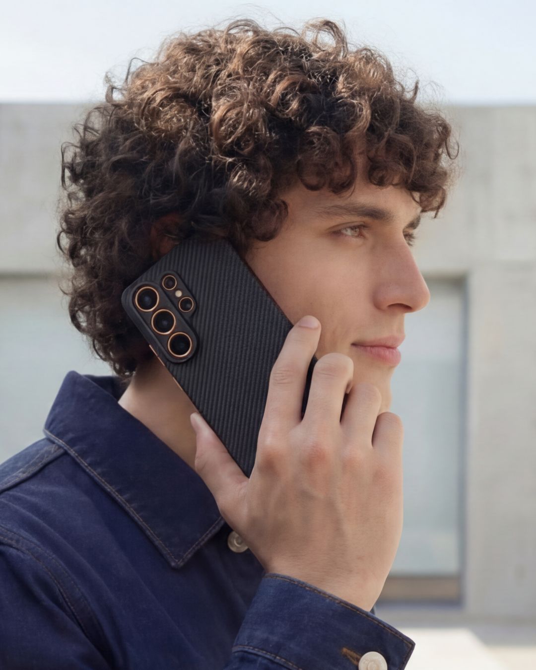 Person holding a phone with a s26 ultra case outdoors