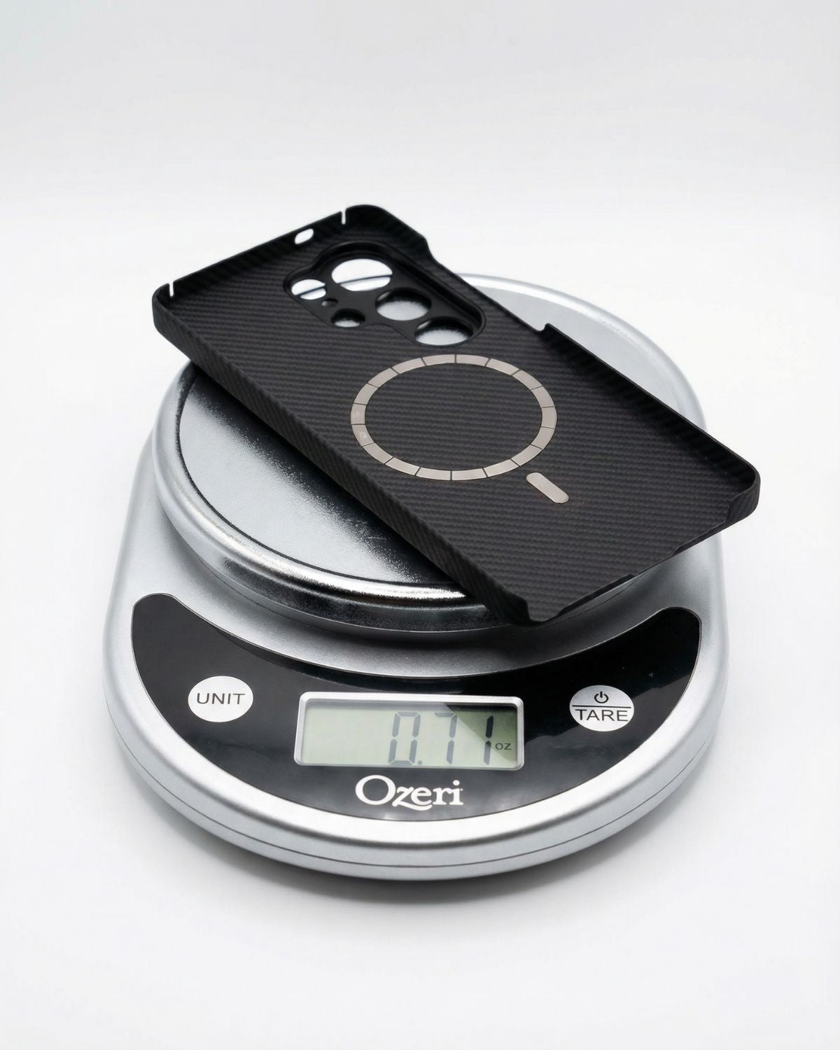 Black galaxy s26 ultra case on a digital kitchen scale, shows 0,71 oz.