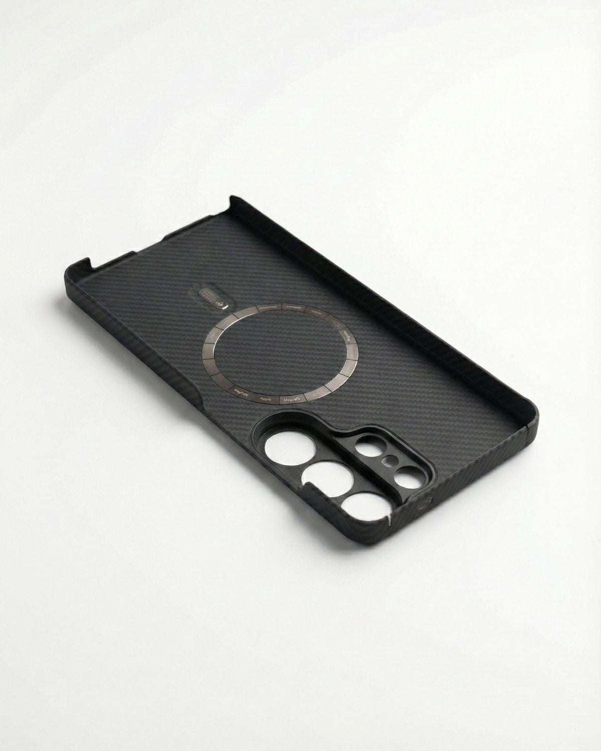 Black samsung s26 ultra case with carbon fiber texture on a white background, shows it is inner design of the magnetic array