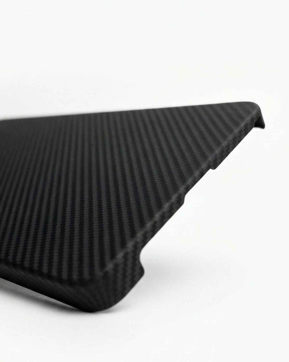 Black textured object on a white background