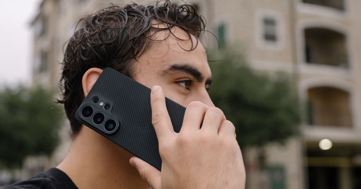 Galaxy S26 Ultra case on the phone, held by a man near his ear.