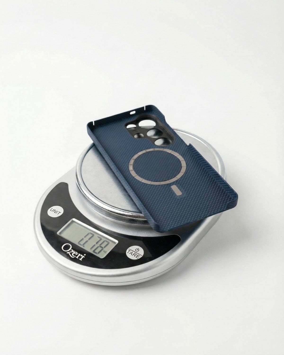 Blue samsung galaxy s26 ultra case on a digital kitchen scale with a white background