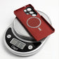Red samsung galaxy s26 ultra case on a digital kitchen scale displaying weight 0.76 oz
