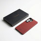 Red galaxy s26 ultra case and black textured box on a white background