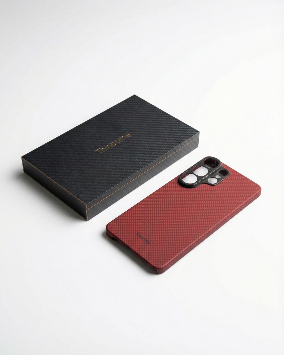 Red galaxy s26 ultra case and black textured box on a white background