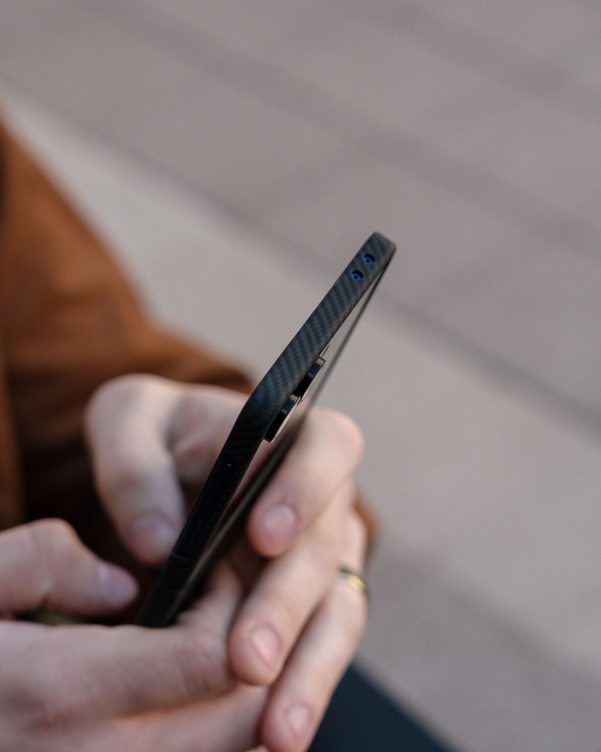 close shot of galaxy z flip 7 with carbon fiber case, showing how thin the case is 
