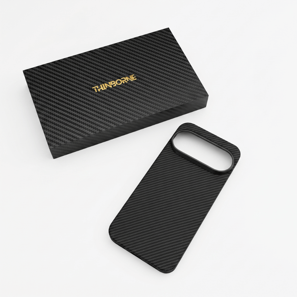 A black carbon fiber textured google pixel 11 pro case shown next to its black presentation box with gold 'THINBORNE' branding, on a clean white background.