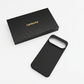 A black carbon fiber pixel 11 pro xl phone case shown next to its black presentation box with gold 'THINBORNE' branding, on a clean white background.