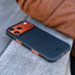 a black iphone 17 pro max case with phone laying on a surface