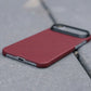 Red iphone air super thin case on a gray surface