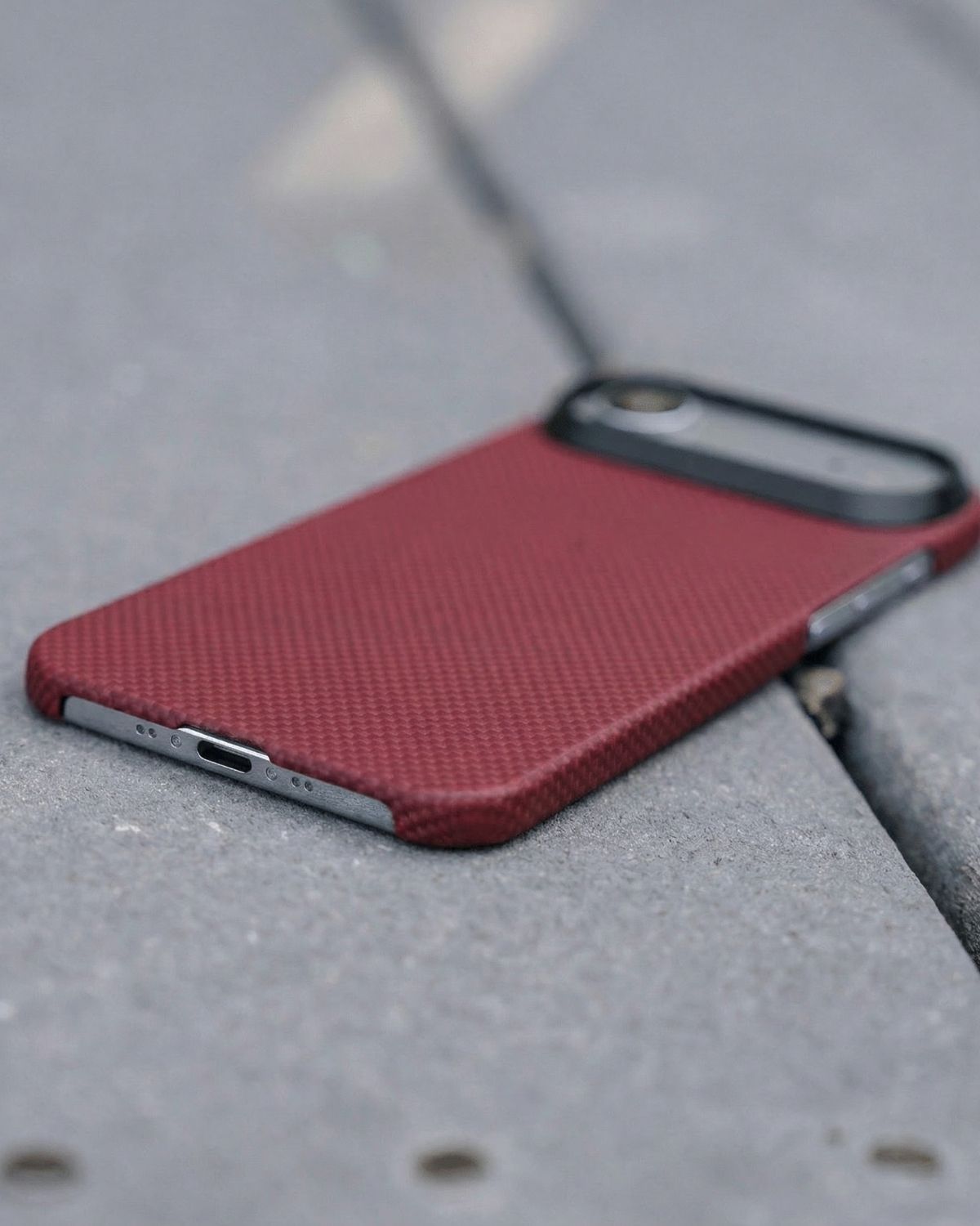 Red iphone air super thin case on a gray surface