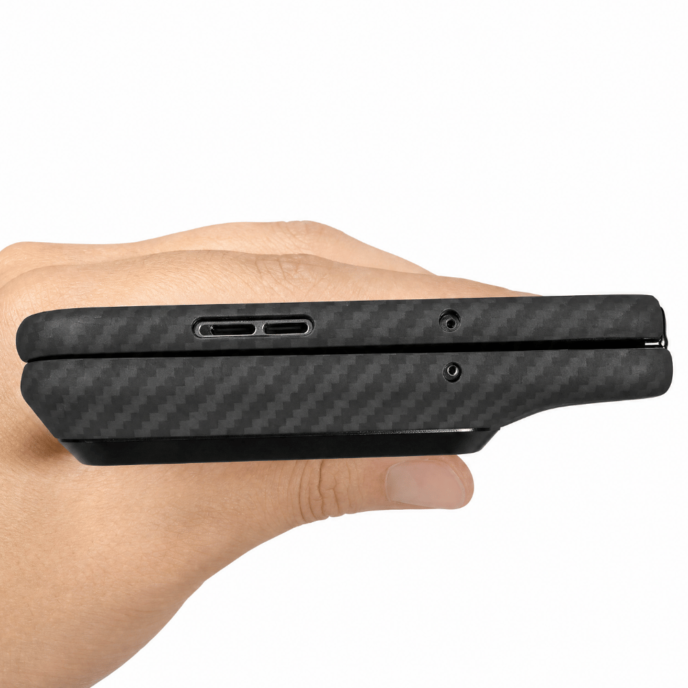 Black carbon fiber razr fold phone case held in a hand on a white background