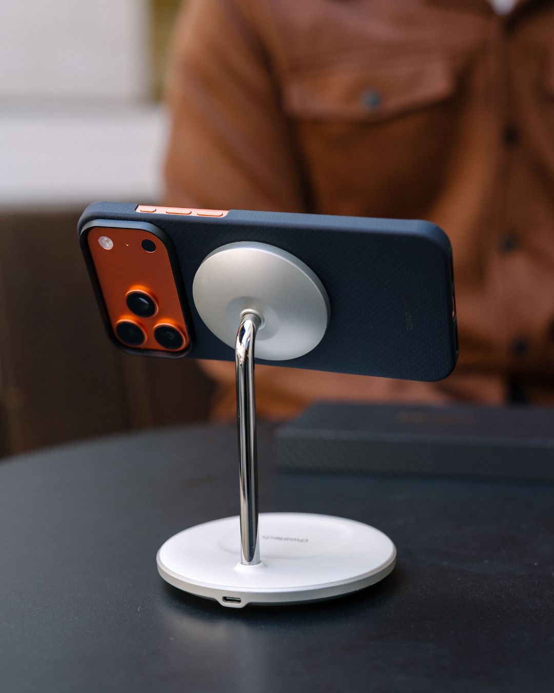 iPhone 17 pro max with case attached to magsafe stand
