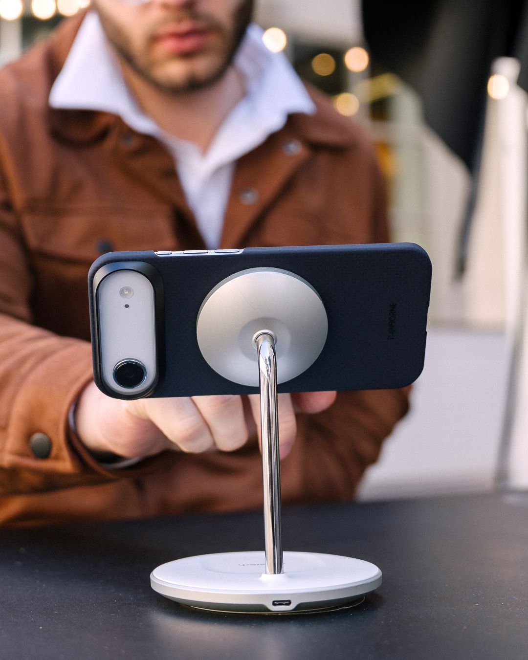iPhone air case on the phone attached to magsafe stand, blurred background