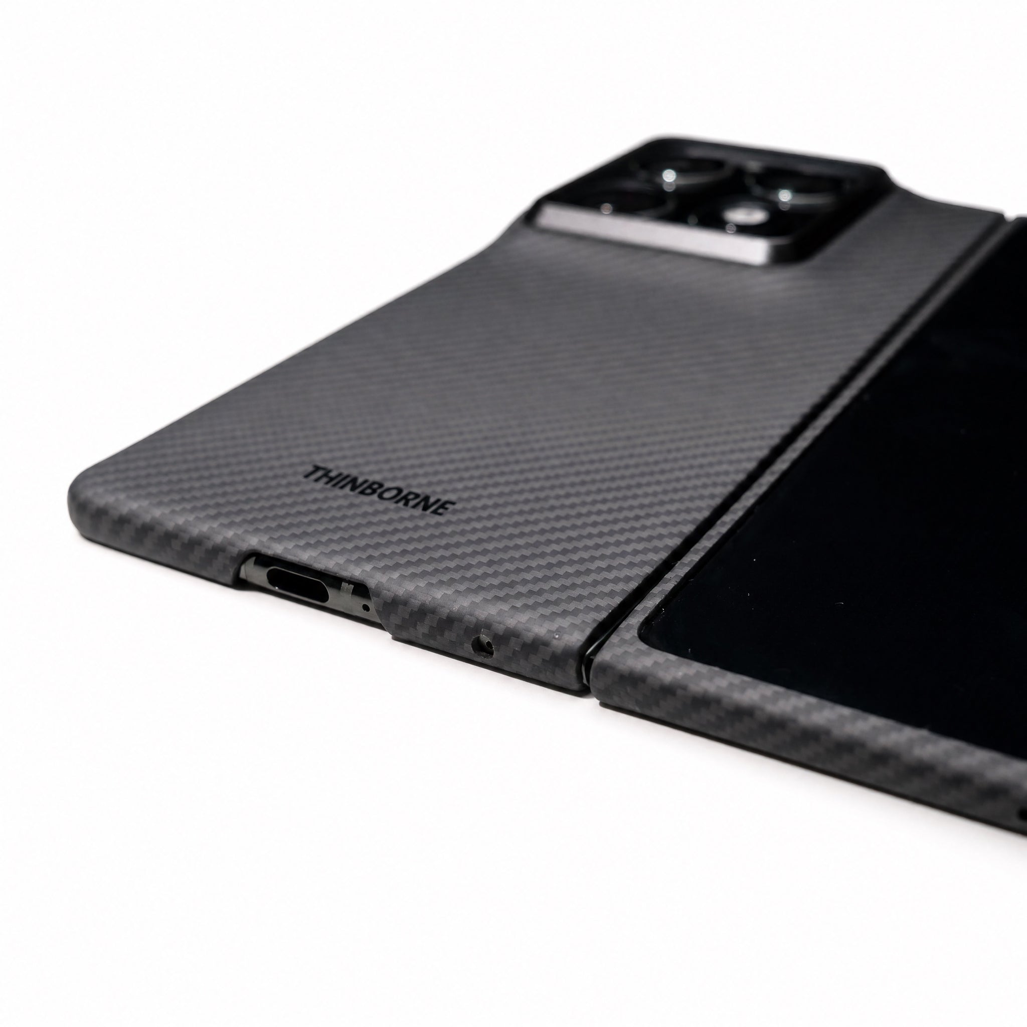 Black moto razr fold phone case with 'ThinBorne' branding on a white background