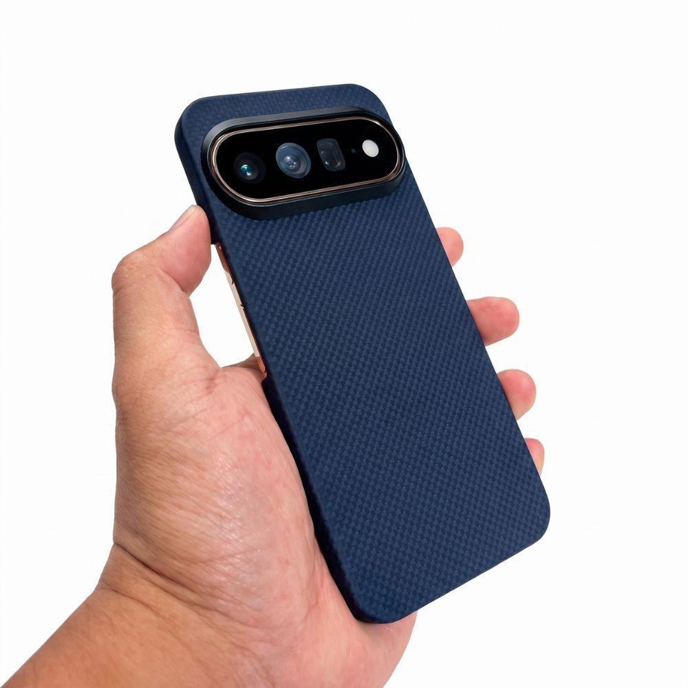 A hand holding a dark blue pixel 11 pro
 phone case with a black camera bar, shown against a plain white background.