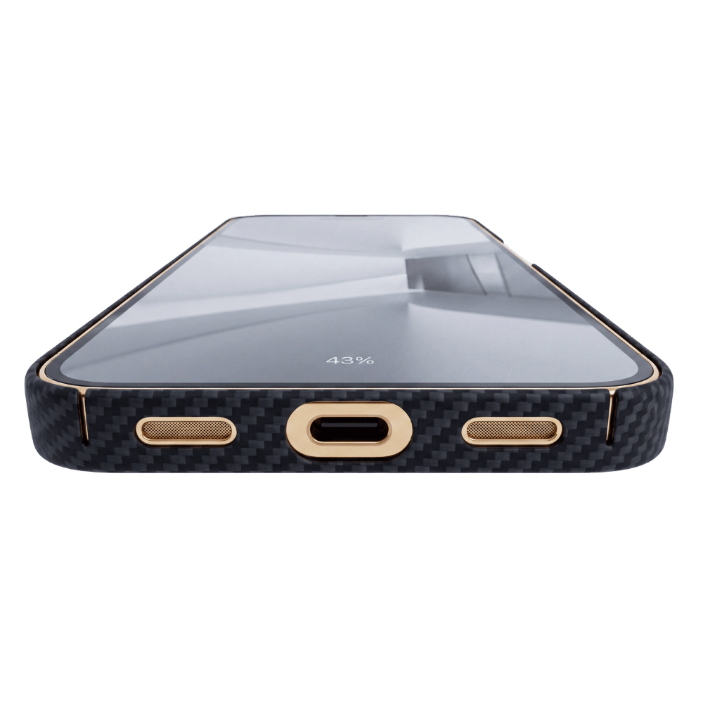 A close-up of a pixel 11 pro xl case showing the bottom edge, featuring a black carbon fiber pattern with gold-plated accents around the USB-C port, speaker cutouts, and edge trim.