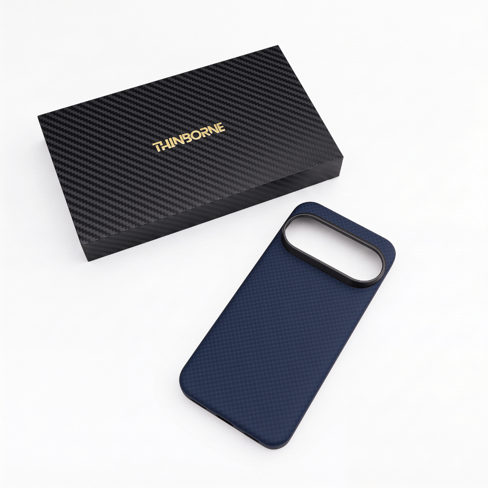 A dark google pixel 11 pro phone case shown next to its branded presentation box on a solid green background. The case is navy blue, and the box is black with a carbon fiber pattern and gold 'T-INDORNE' branding.
