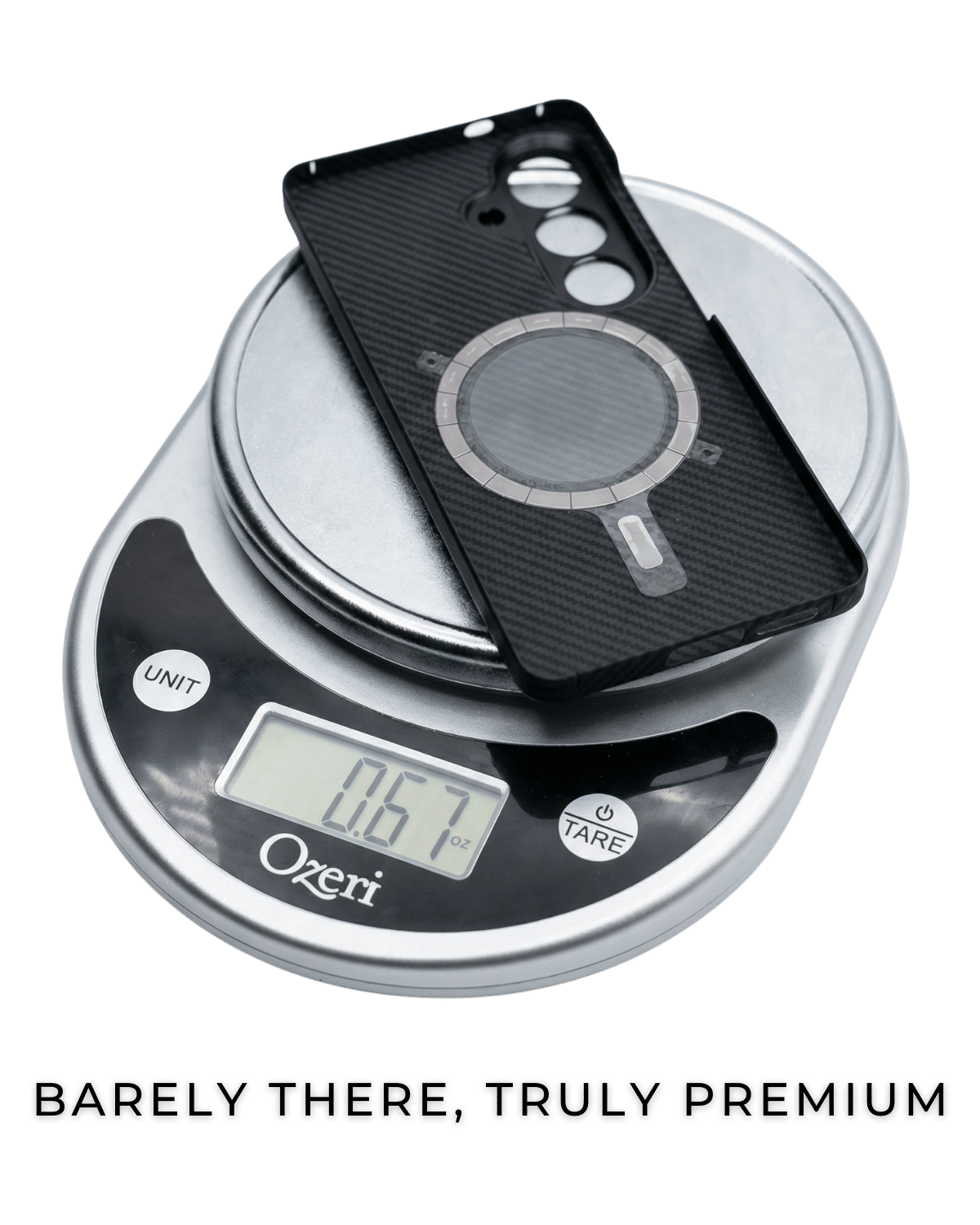 Black samsung galaxy s26 plus case case on a digital scale with 'Ozeri' branding, text 'BARELY THERE, TRULY PREMIUM' below.